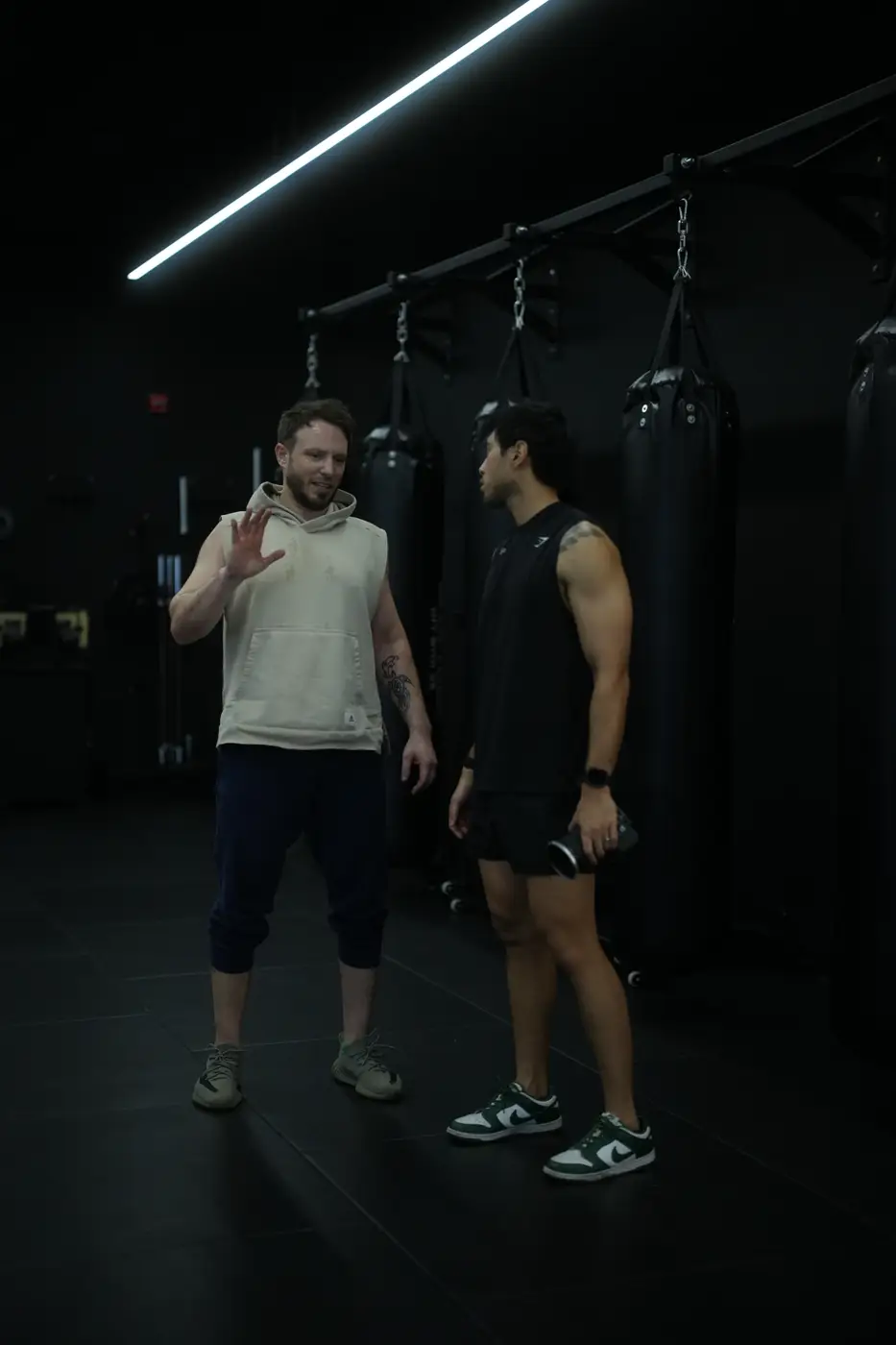 Coach and athlete talking between sets